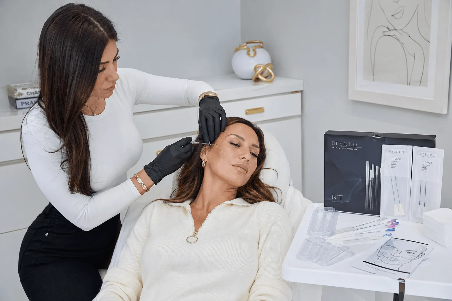 Aesthetic nurse performing non-surgical thread lift treatment on female patient