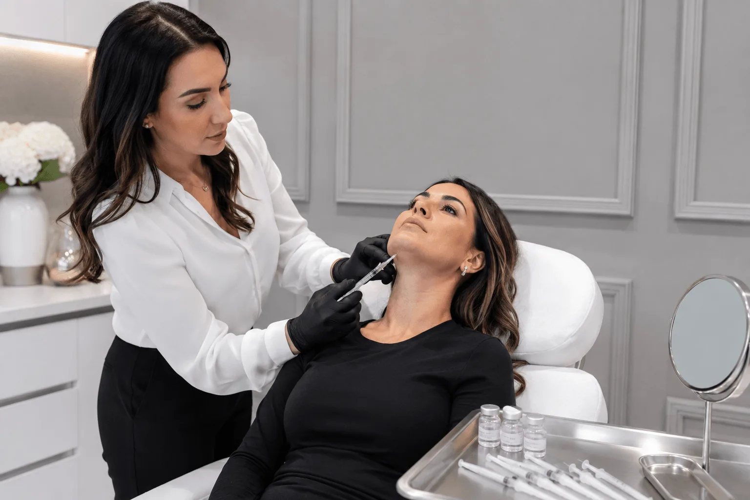 Aesthetic nurse performing non-surgical neck rejuvenation injectable treatment
